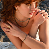 Forest ring i 18 karat förgyllt silver med små blad och vita topas ädelstenar